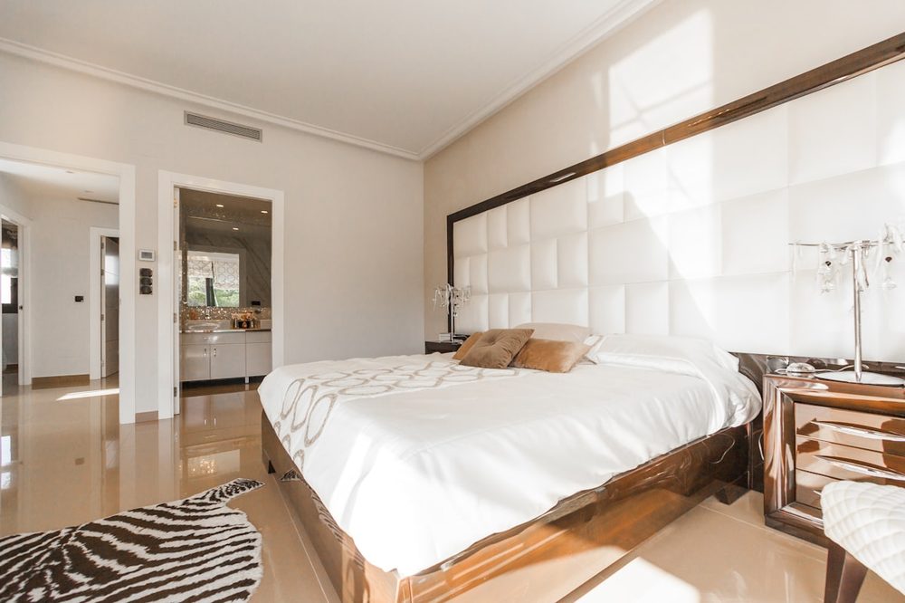 A freshly made villa bedroom ready for guests