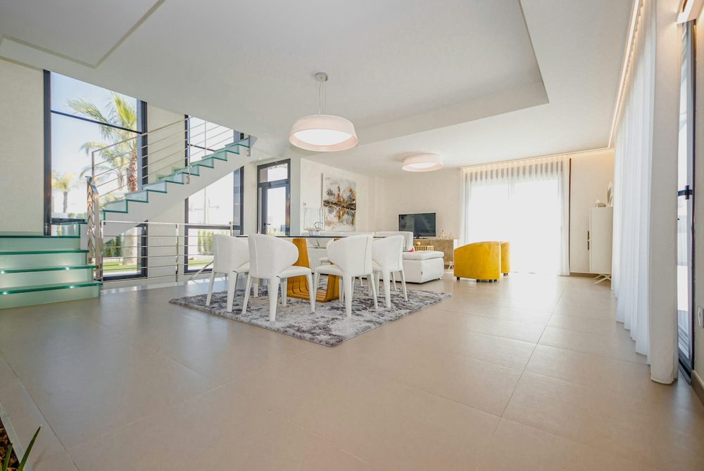Spotless open-plan living room in a luxury Marbella villa prepared for holiday guests